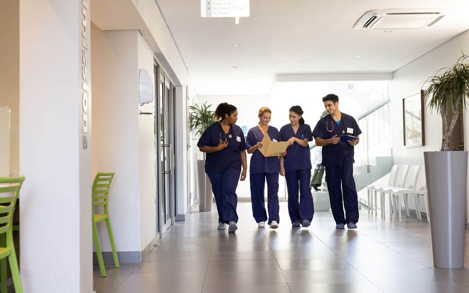 diverse-group-of-happy-male-and-female-doctors-tal-2023-11-27-05-37-15-utc